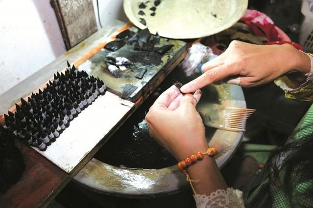 园,包括"一馆,一街,一祠,一厂,一寺",即中国湖笔文化馆,湖笔一条街,蒙