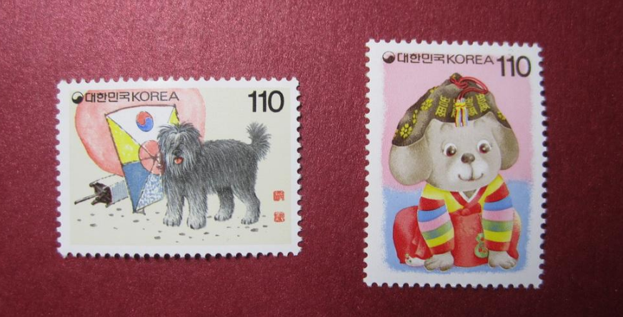 1994年美国发行的生肖狗邮票,以独特的剪纸风格和汉字,展现了新年之喜