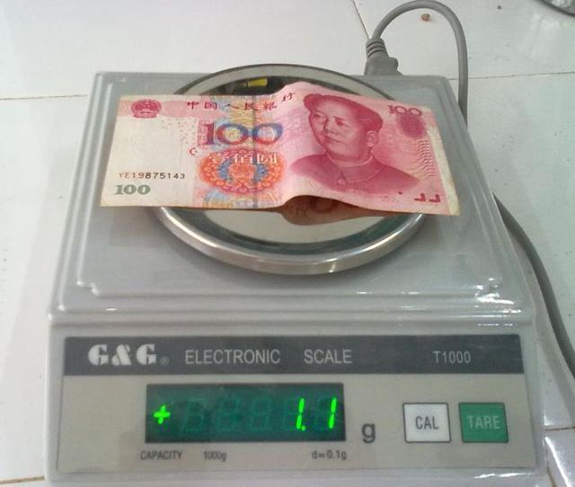 一张一百块钱钞票的重量是1.1克,请问3斤百元大钞,到底有多少钱?