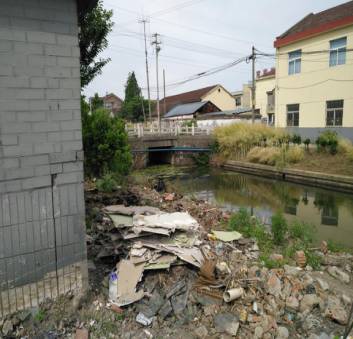 建设村垃圾房(整治后)建设村垃圾房(整治前)建设村季华路东头垃圾房