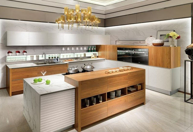 l型橱柜布局设计使空间更加宽阔,半高柜方便摆放电器和用品,绿色背景