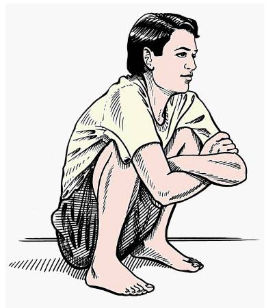 一个人抱腿蹲着的图片图片